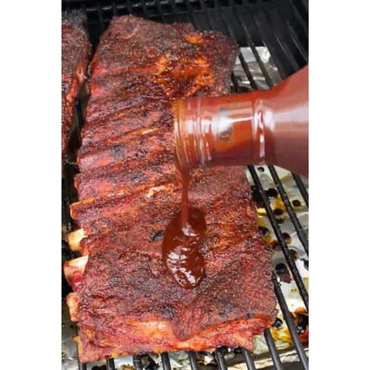 Old Southern BBQ Southern Gal’s Sauce getting drizzled on ribs