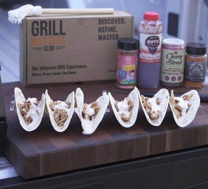 Grill set-up for slow smoking pulled meats with pulled chicken tacos