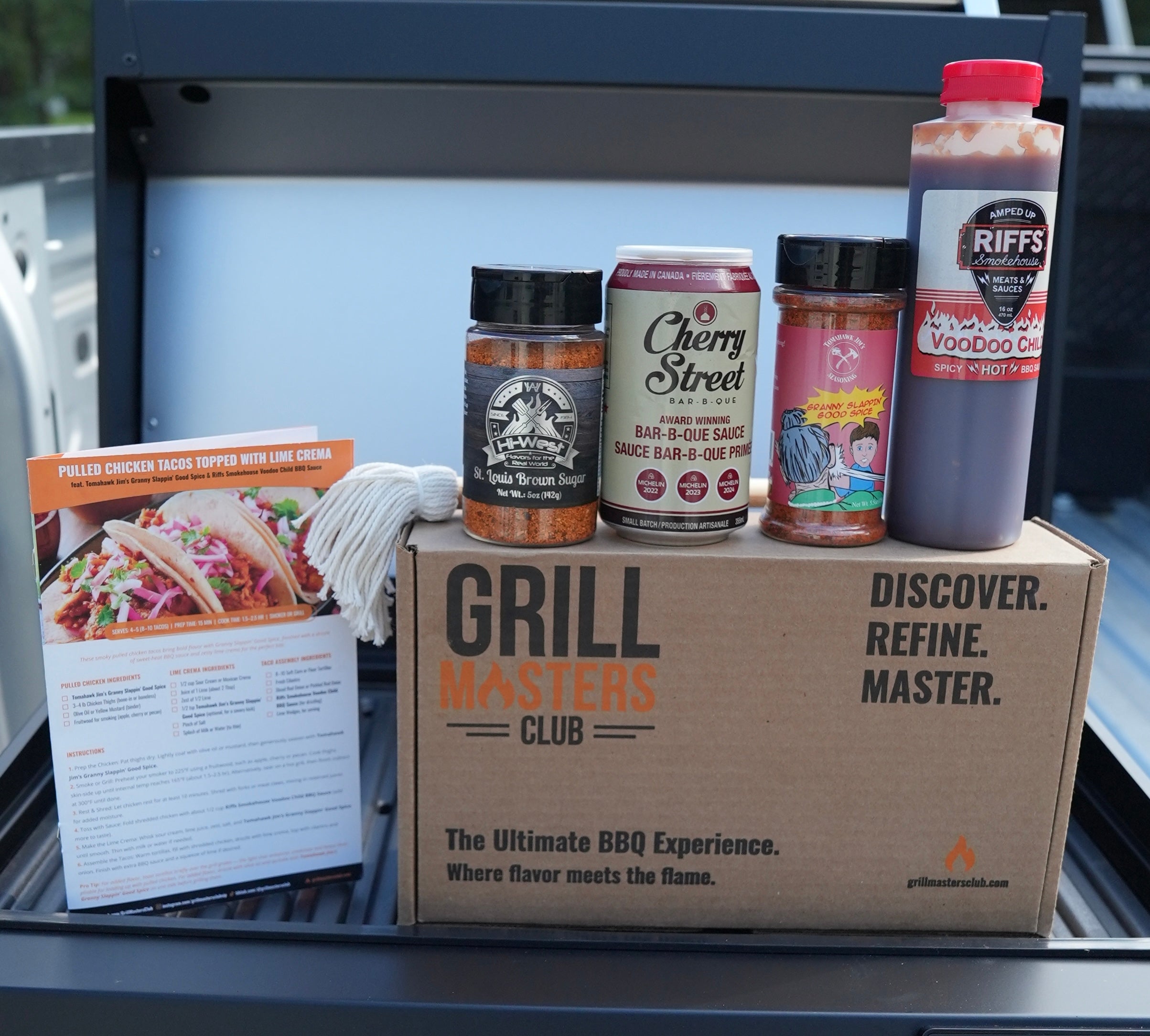 Flat-lay image of all five premium products and accessories from Pulled Perfection box