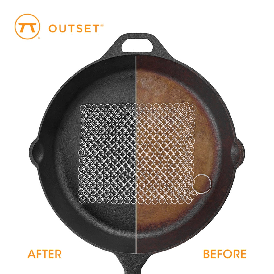 cast iron chainmail scrubber in use removing burnt food