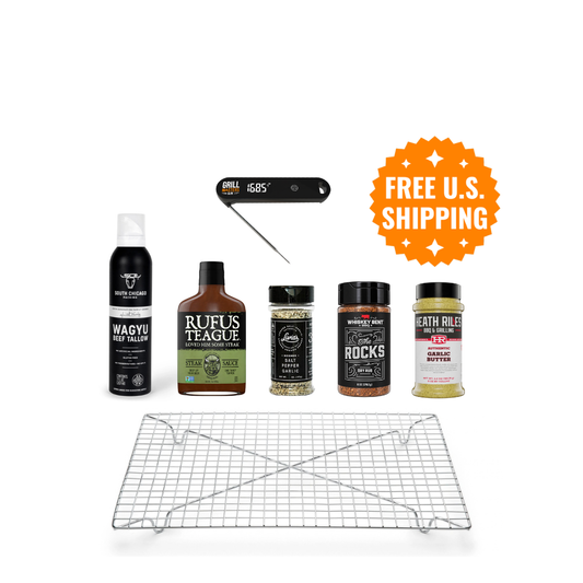 Upper Crust Steak Box contents: thermometer, dry brining rack, wagyu tallow spray, Livia's SPG, The Rocks rub, Heath Riles Garlic Butter Rub and Rufus Teague Steak Sauce