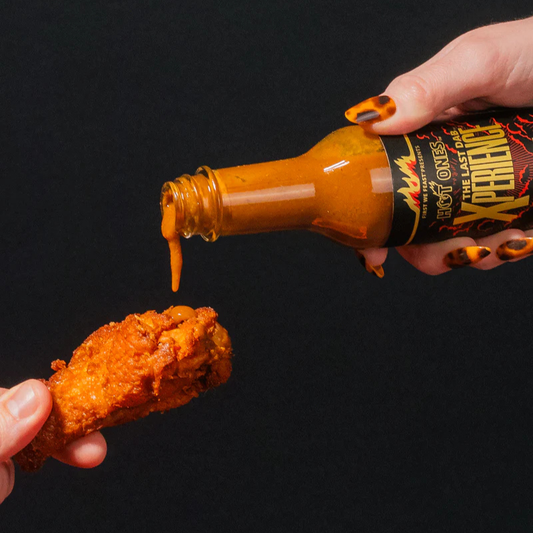 The Last Dab Xperience Hot Sauce by Hot Ones on a Chicken Wing
