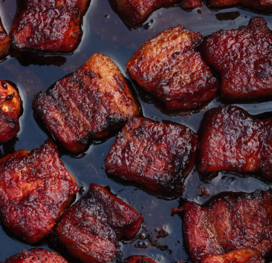 Close-up of pork belly burnt ends with glaze from the Burnt Ends box